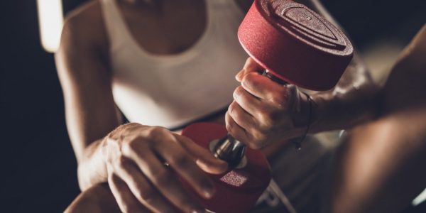 Close Up Of A Woman Having Strength Exercises With Hand Weight In A Picture Id1040222366